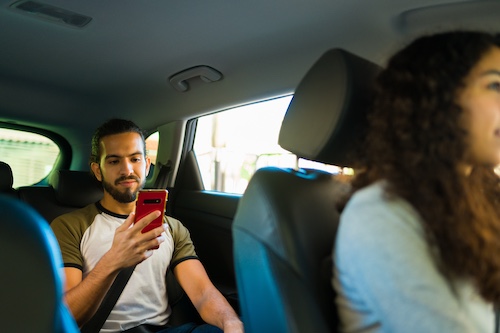 Passenger In The Back Of Car - Rideshare vs Traditional Taxi