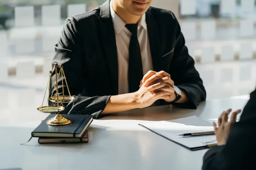 Bicycle accident attorney consulting with injured cyclist client about legal rights and compensation