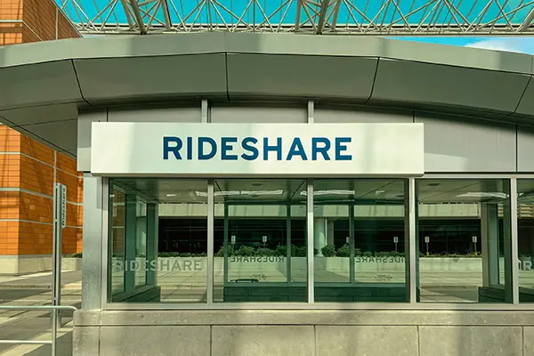 Uber accident lawyer in Knoxville reviewing rideshare building and transportation services for legal case preparation.