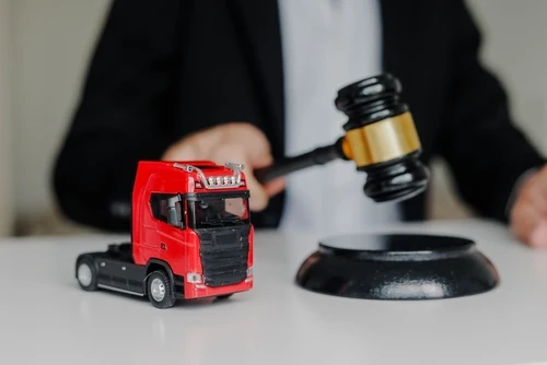 Knoxville car accident lawyer with miniature truck and judge gavel